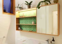 Bright-and-light-filled-bathroom-in-white-with-wooden-medicine-cabinet-217x155