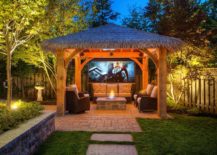 Bring-the-exotic-tropical-resort-vibe-to-the-backyard-with-a-cool-hut-and-outdoor-home-theater-217x155