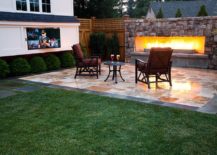Cozy-outdoor-home-theater-for-two-with-a-fireplace-217x155