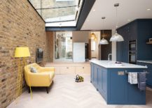 Fantastic-kitchen-area-and-social-zone-of-London-home-with-skylight-and-brick-wall-217x155