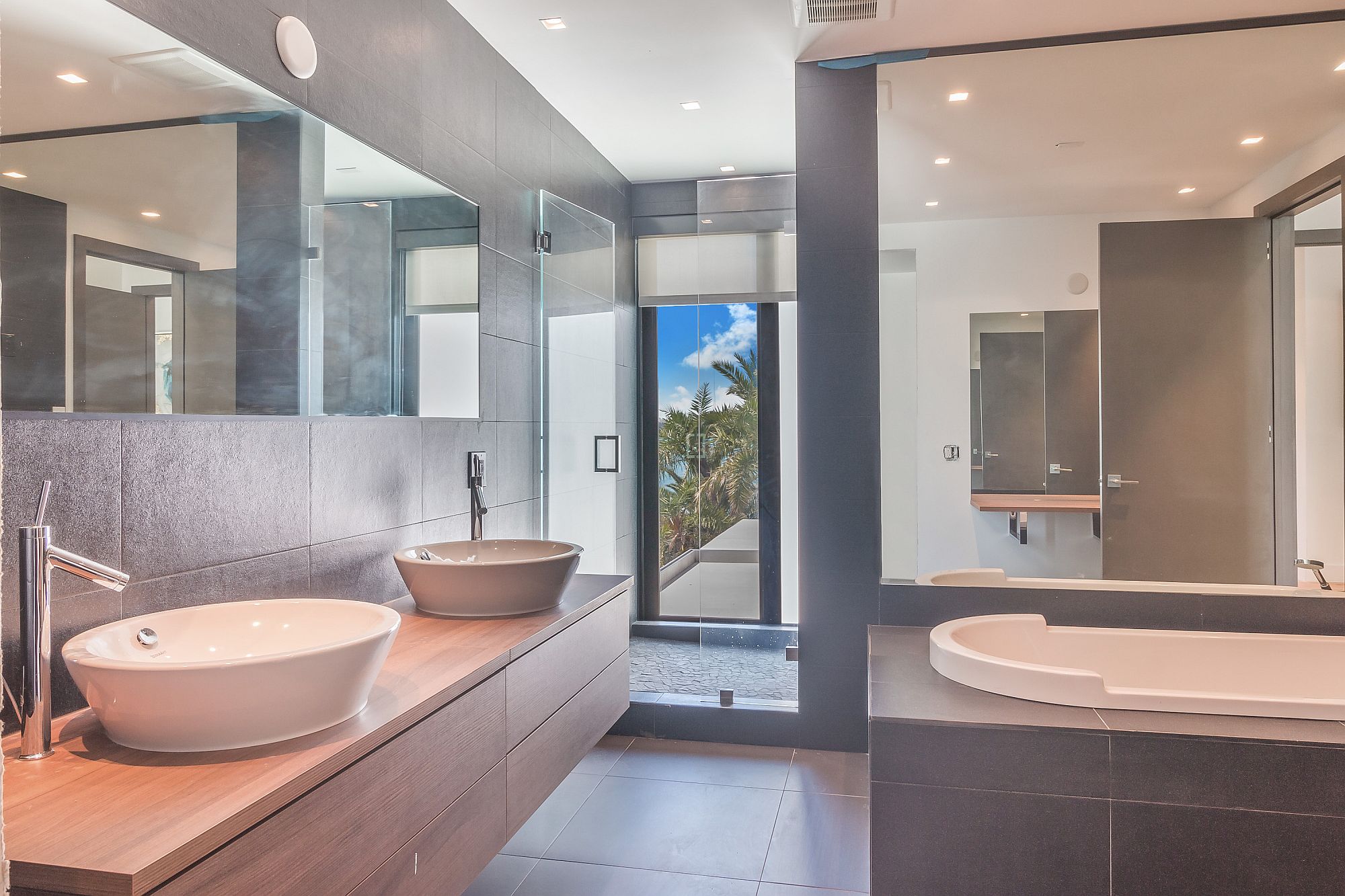 Floating wooden vanity in the modern minimal bathroom