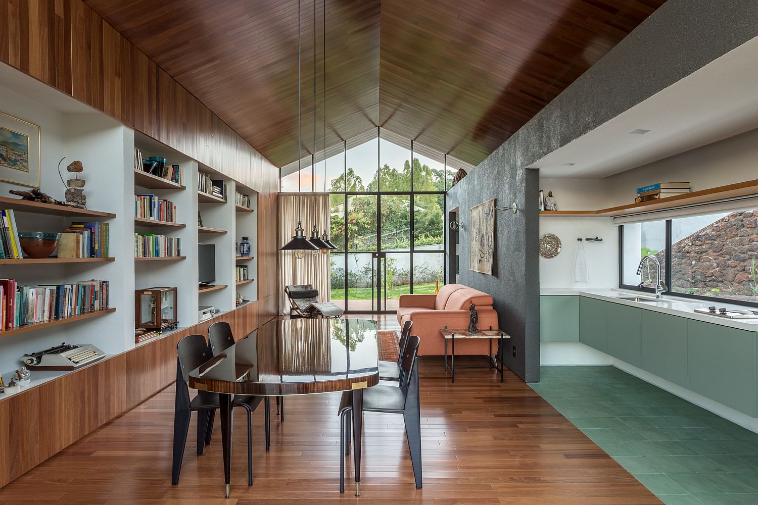 Loft Branco: Backyard Office and Guest Space with Gabled Metallic Roof