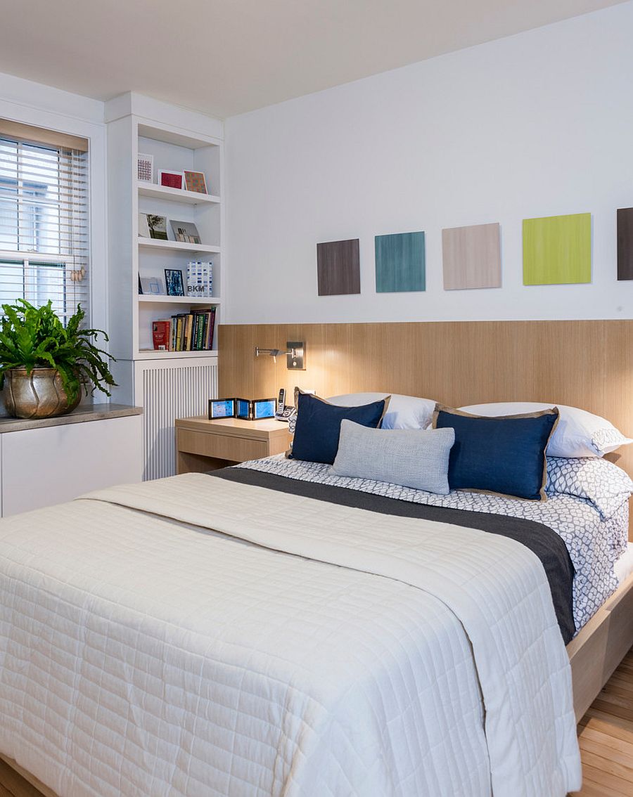 Headboard and flooring brings woodsy element to this contemporary kids' bedroom in white