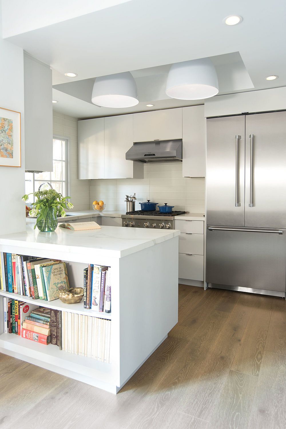 Kitchen in pale gray and white with natural French Oak flooring
