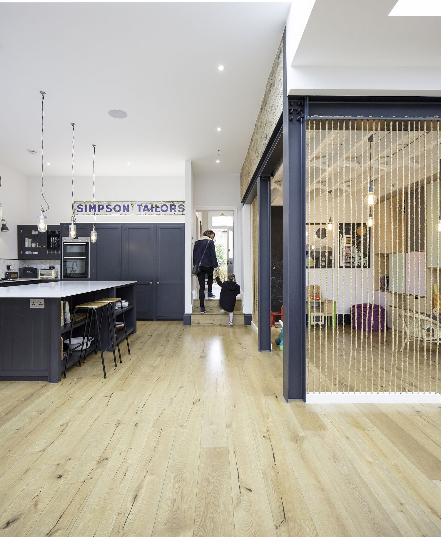 Kitchen of the converted London hom feels like an extension of the living room