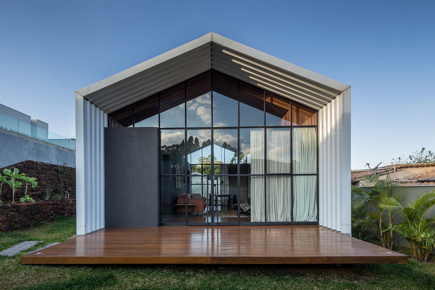 Large glass windows offer visual connectivity with the outdoors