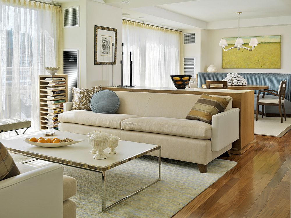 Modern living room with sheers that imbibe a bit of yellow to the setting