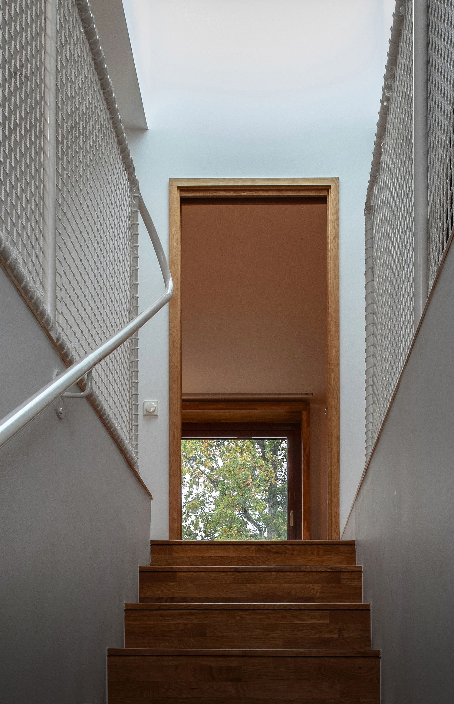 Narrow staircase leading to the new upper level