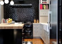 Painted-kitchen-brick-wall-backsplash-in-black-with-a-glossy-finish-217x155