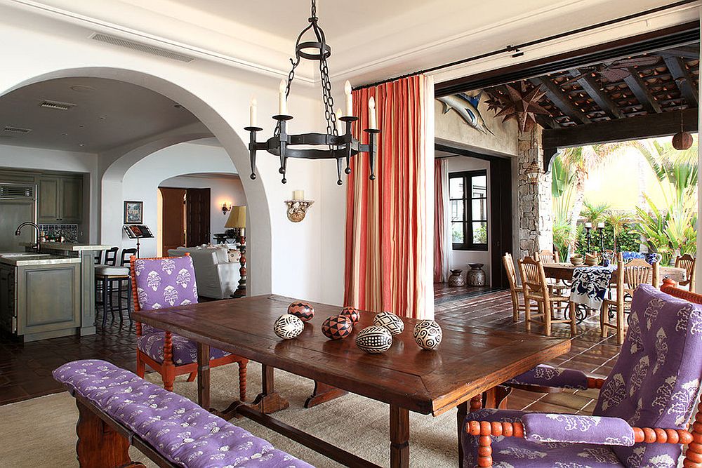 Spacious Mediterranean style dining room with drapes in coral and white