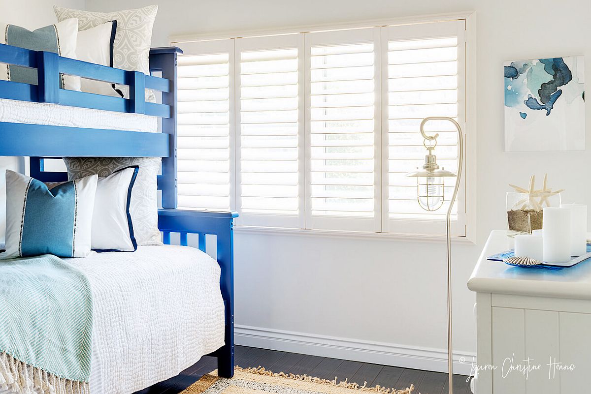 Summer cabana bedroom in white with blue accents and decor all around