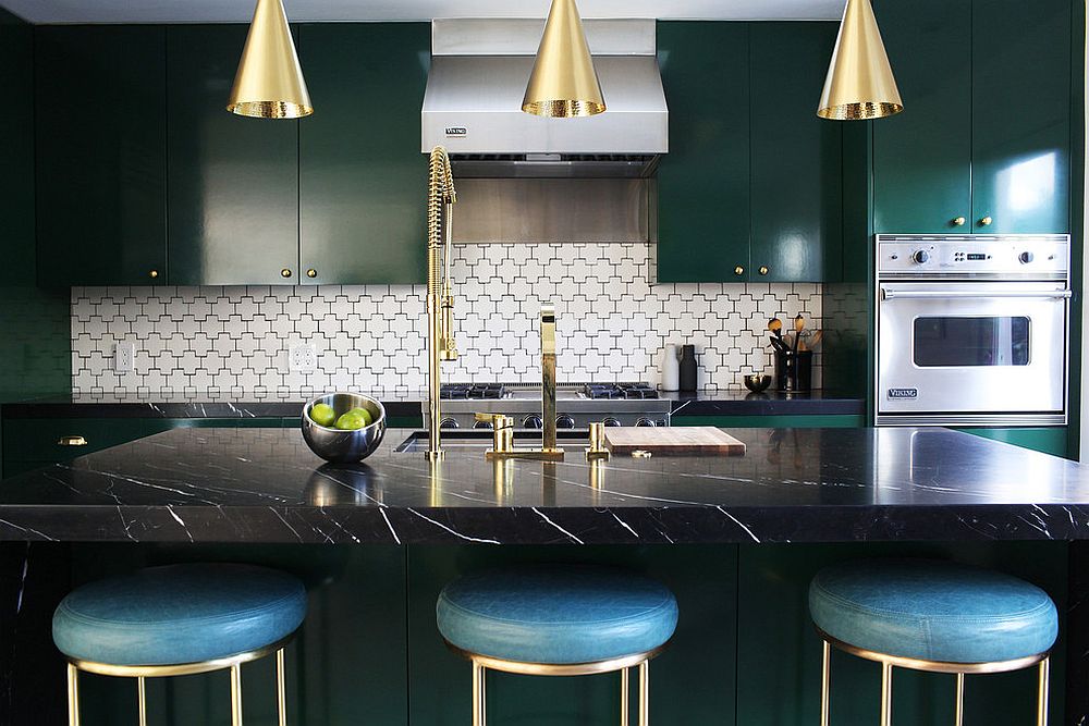 Trio of brass pendants along with kitchen fixtures bring brightness to the space