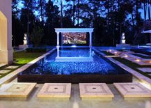 Tropical-style-home-theater-outdoors-that-can-be-turned-into-just-a-pool-hangout-when-needed-217x155