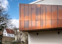 Weathered-copper-panels-for-the-upper-level-of-the-contemporary-home-217x155