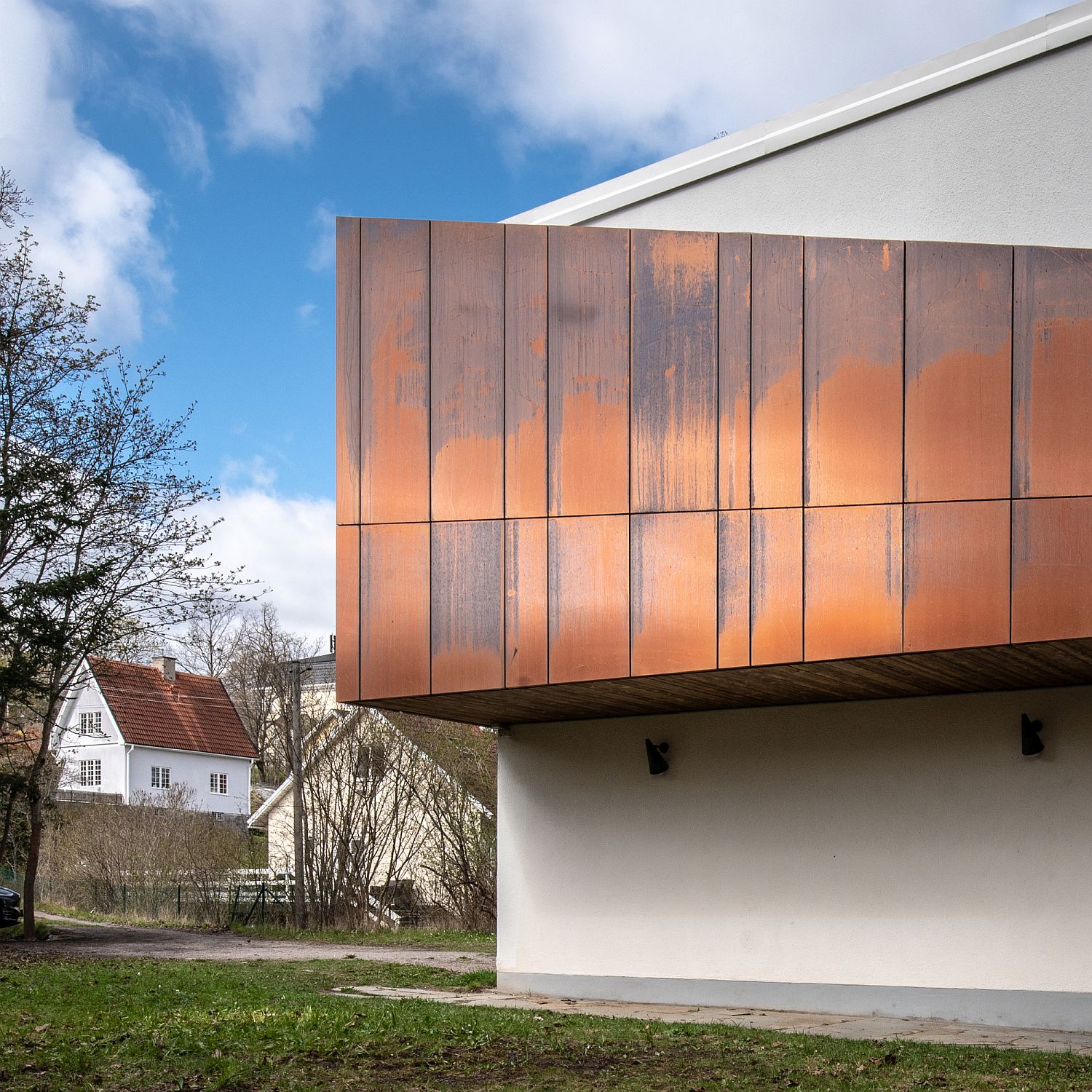 Weathered copper panels for the upper level of the contemporary home
