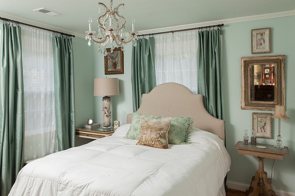 White sheers combined with dark gray drapes in the traditional bedroom