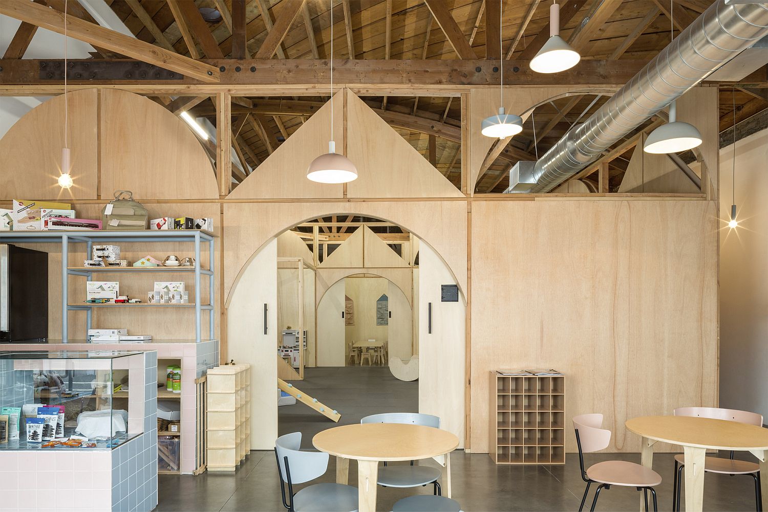 Wooden ceiling beams and walls bring warmth to the contemporary space