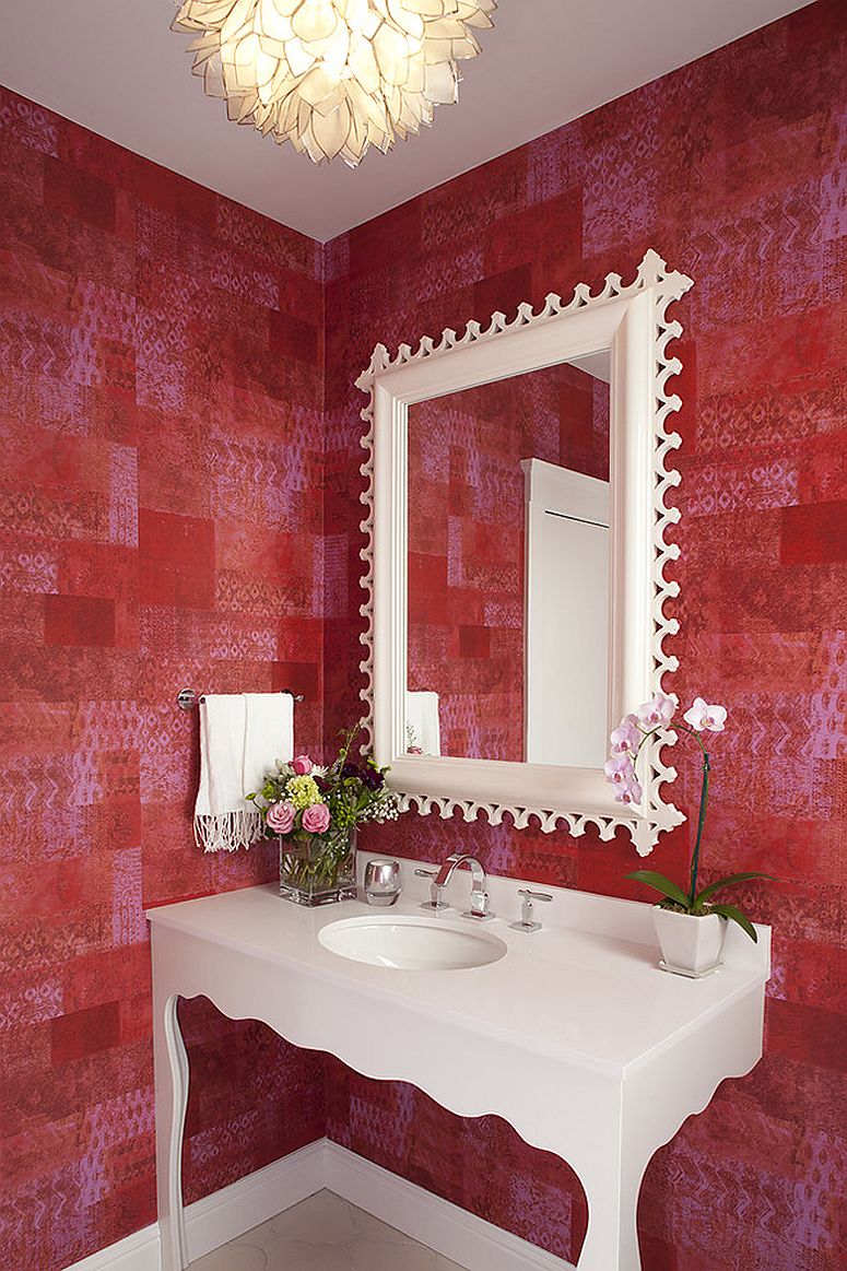 Awesome eclectic bathroom in red with patchwork wallpaper that sets the mood