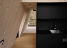 Black-and-wood-tiny-kitchen-space-inside-the-cabin-217x155
