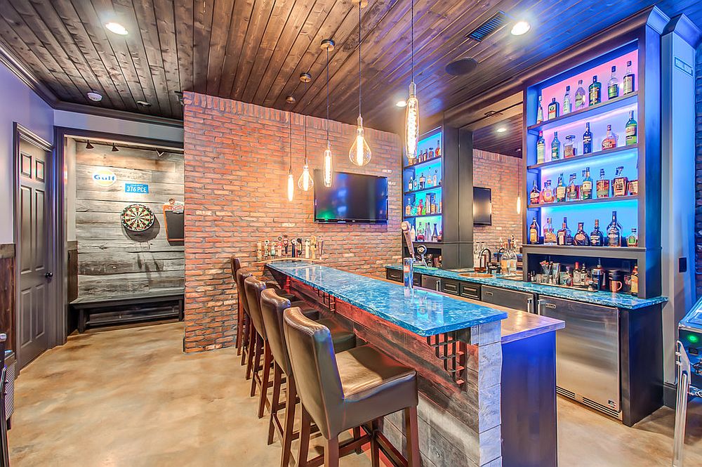 Budget basement bar and gameroom idea with brick walls and vintage appeal