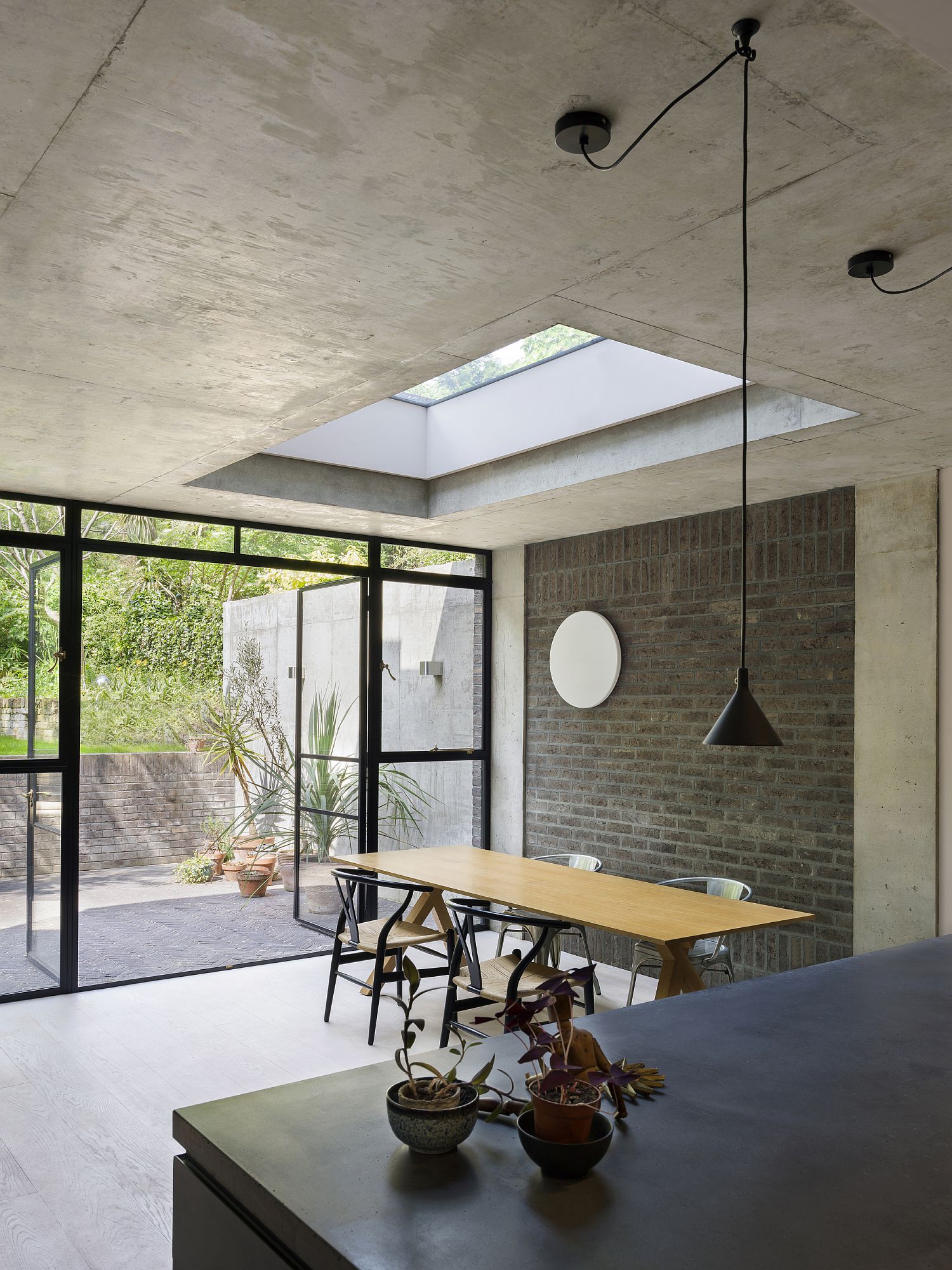 Concrete is used elegantly inside the kitchen area