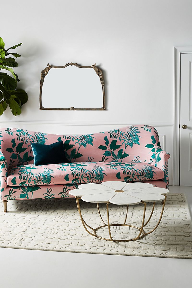 Curved sofa with pink and green fabric