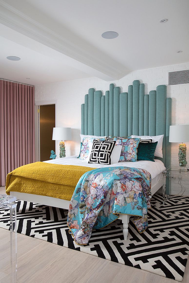 Eclectic-bedroom-with-patterned-rug-and-pastel-hues