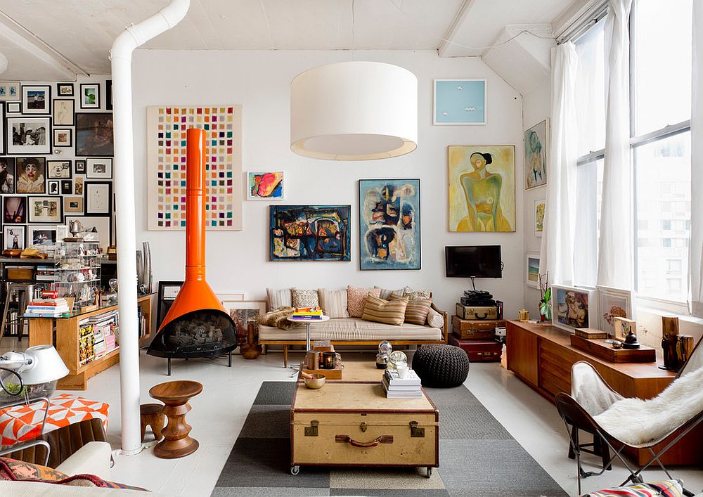 Eclectic living room with suitcases in the corner and a cool coffee table in the center