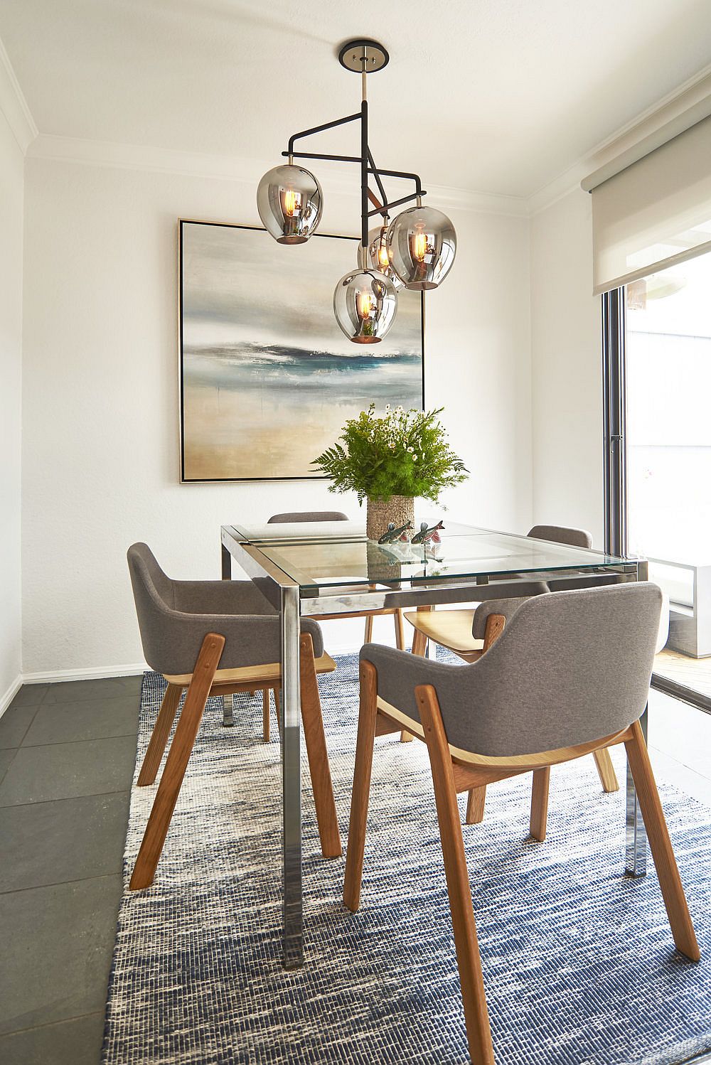 Gray chairs and metallic lighting fixture for the modern dining room