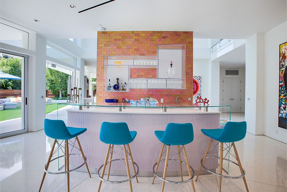 Light blue bar stools in kitchen with ample natural lighting