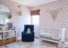 Light-filled-beach-style-nursery-with-a-wallpapered-backdrop-that-features-elephant-motifs-217x155