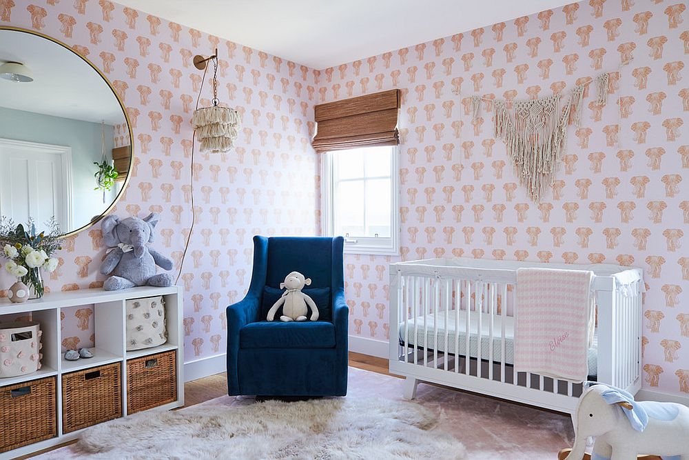 Light-filled-beach-style-nursery-with-a-wallpapered-backdrop-that-features-elephant-motifs