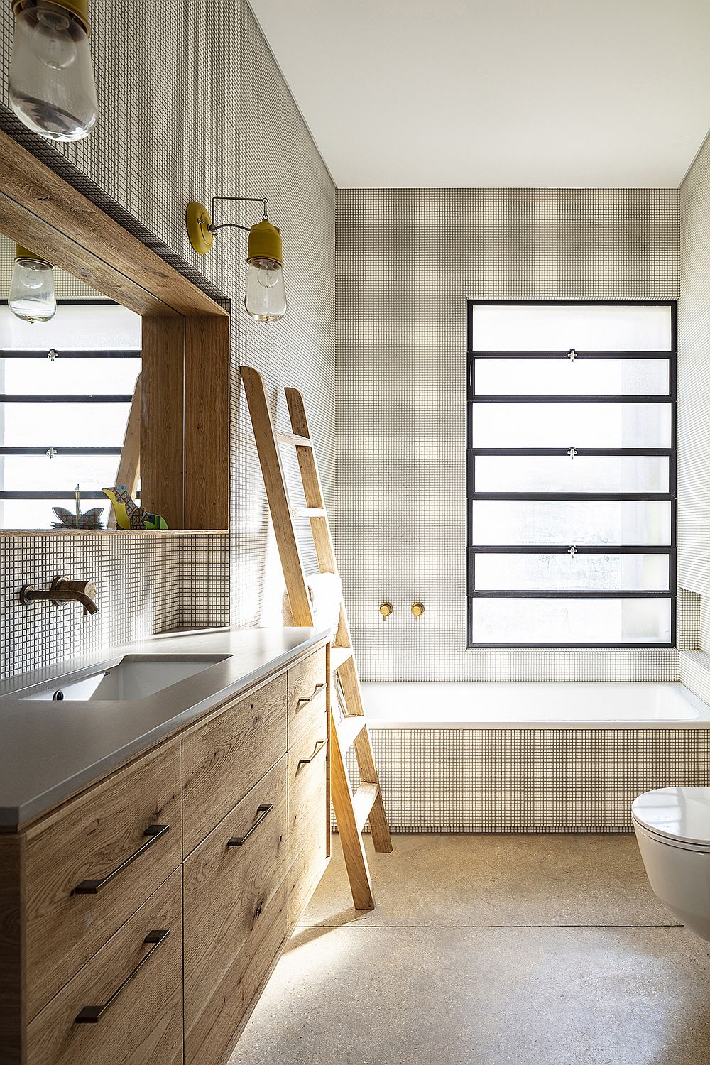 Light-filled modern bathroom in white and wood