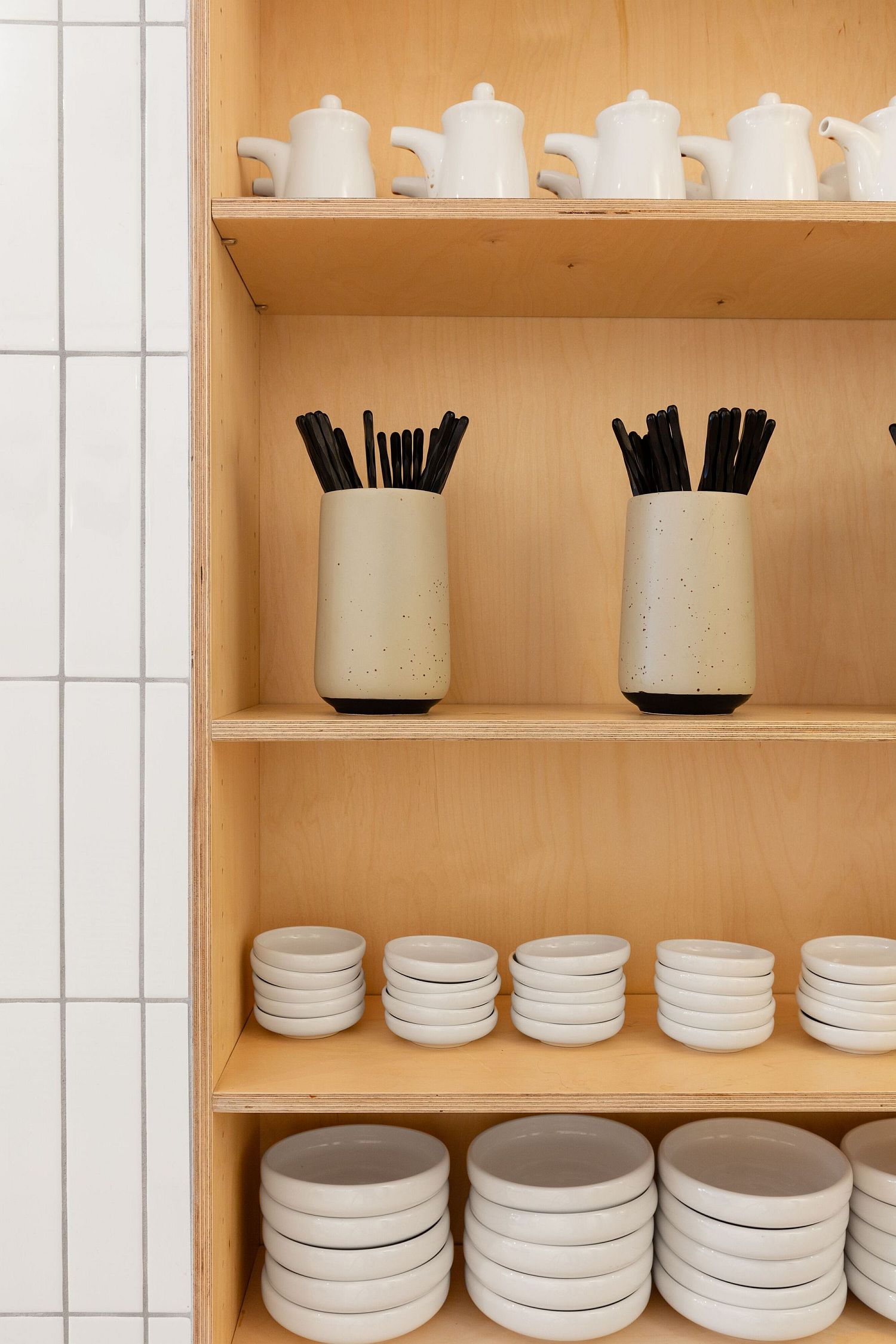 Minimal wooden shelves inside the Japanese cafe