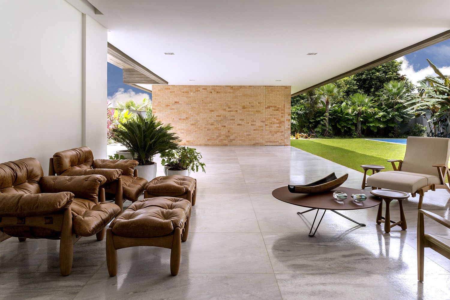 Open-style living area next to the pool brings the outdoors inside