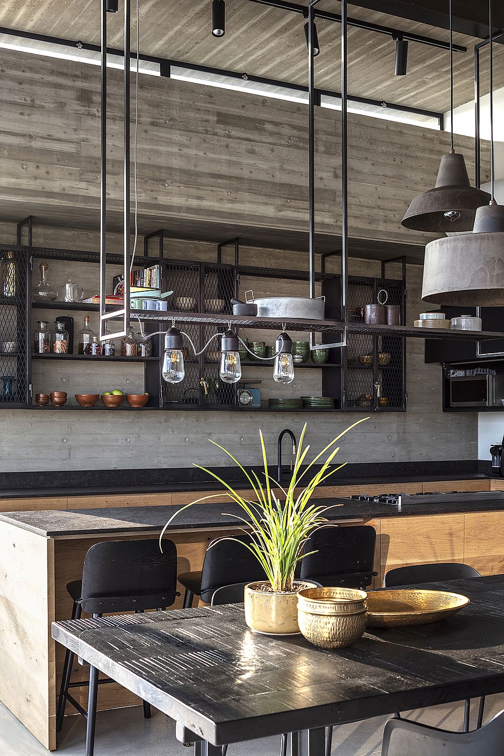 Pendant lights above the dining area with industrial style