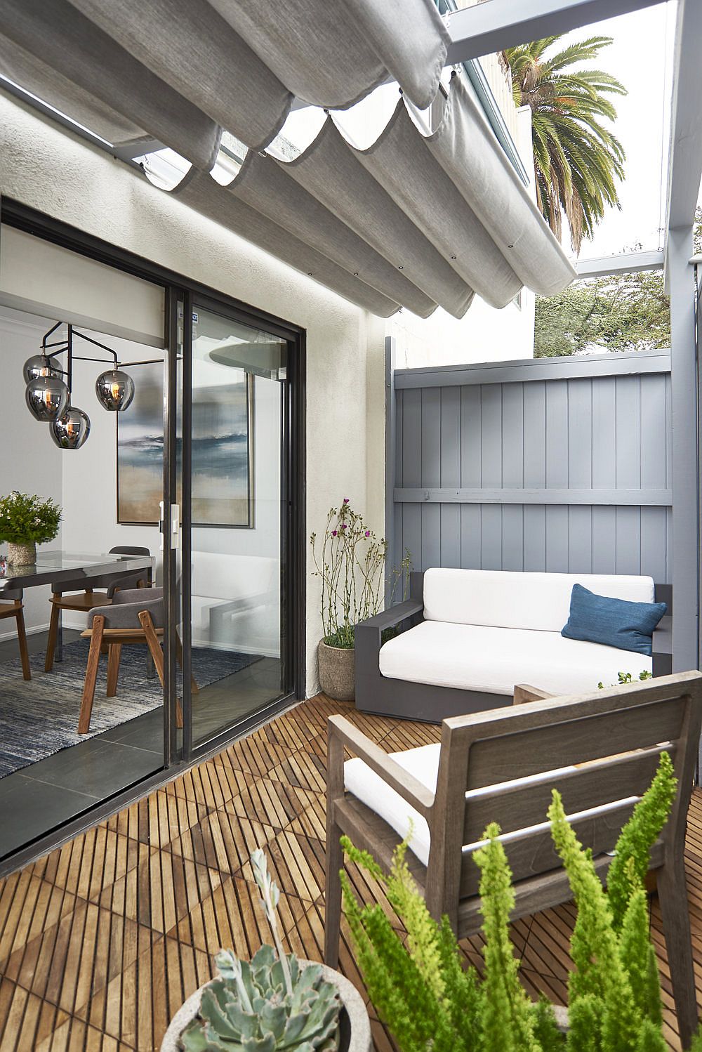 Small private backyard deck with a dash of greenery