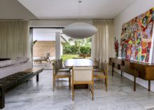 Smart-lighting-and-large-painting-for-the-modern-dining-area-217x155