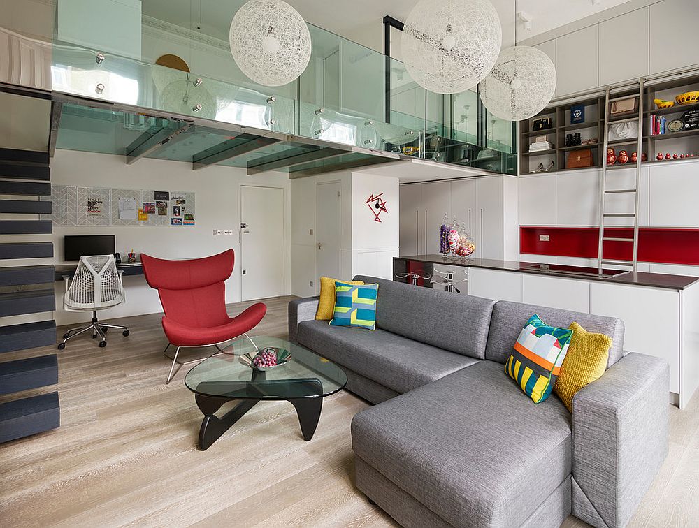 Steel and glass mezzanine level of the London apartment is eye-catching