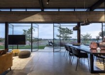Swiveling-glass-doors-connect-the-living-room-with-the-open-field-outside-217x155