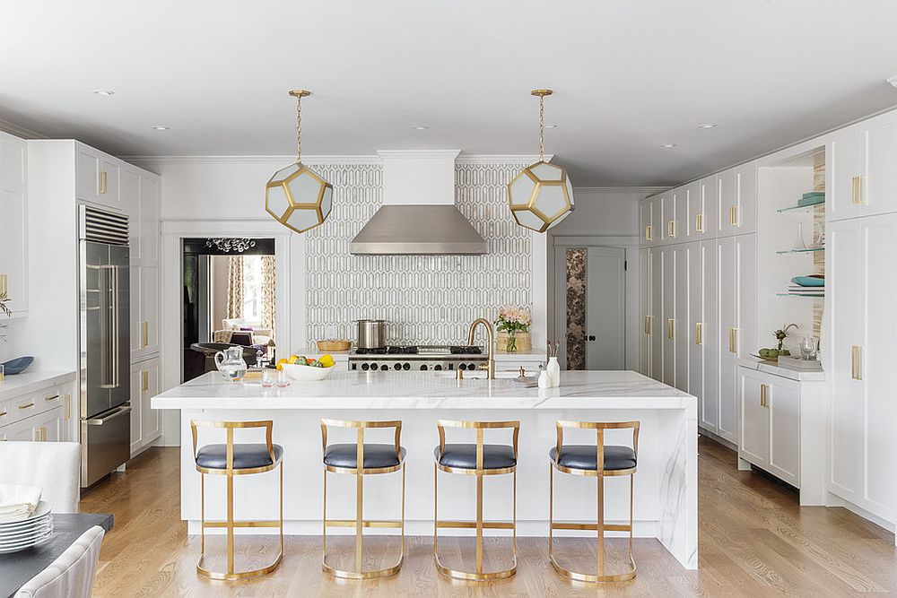 TRansitional kitchen with brass framed bar stools and a marble countertop