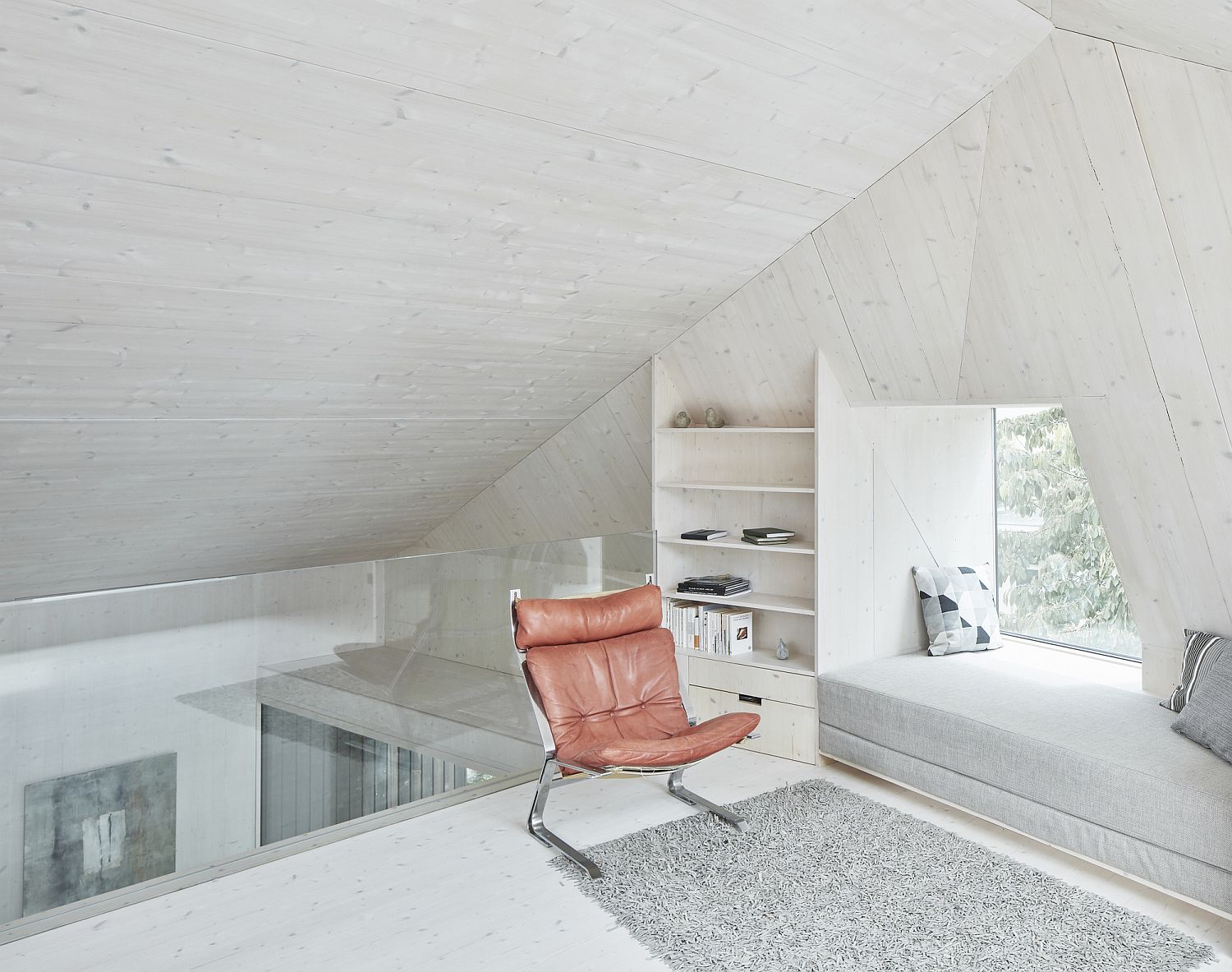 Upper level sitting area with lovely windows seats and smart cut-outs that bring the outdoors inside