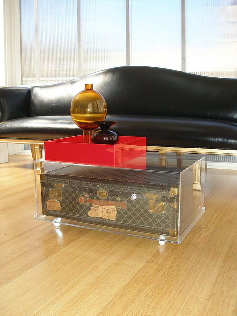 Vintage trunk encased in a cool acrylic box to create a stunningly unique coffee table