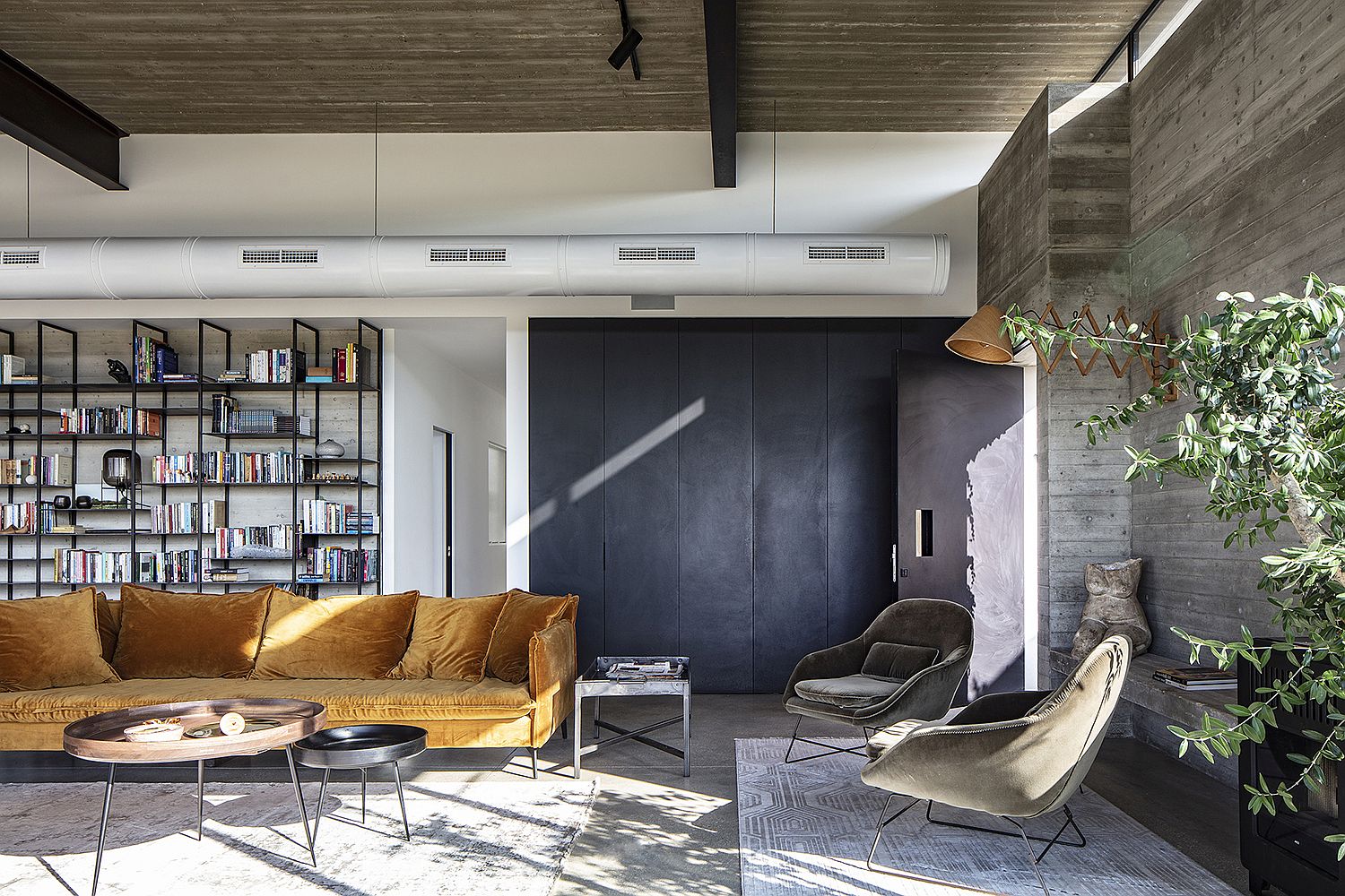 Wooden walls and metallic bookshelf inside the living room