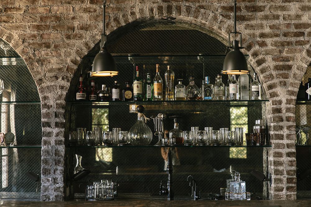 Arches and brick walls give the home bar a touch of authencity