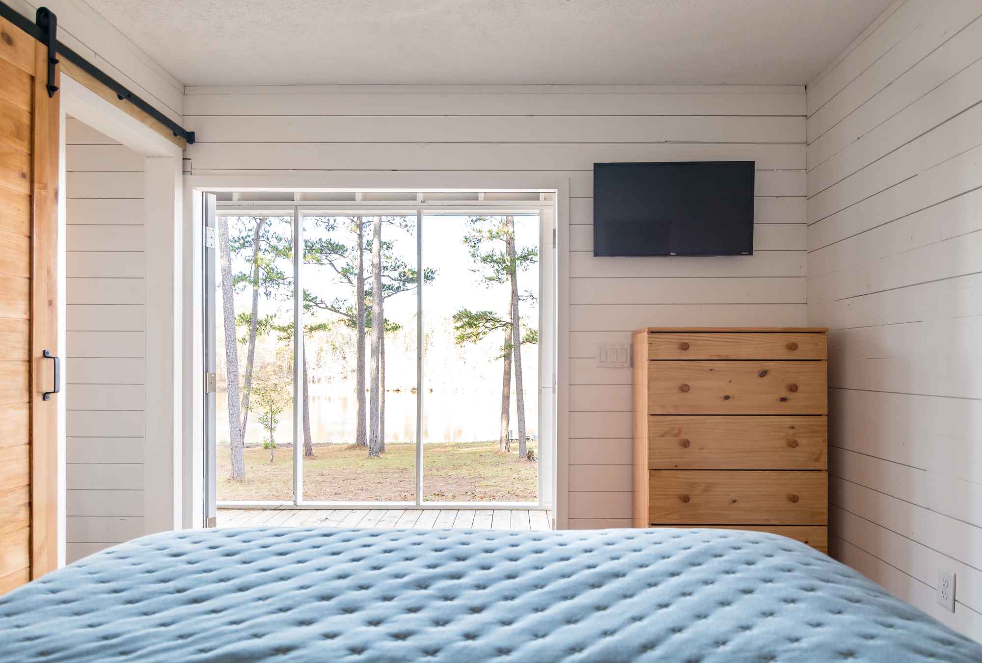 Bedroom of the tiny house with a wonderful view of the woods