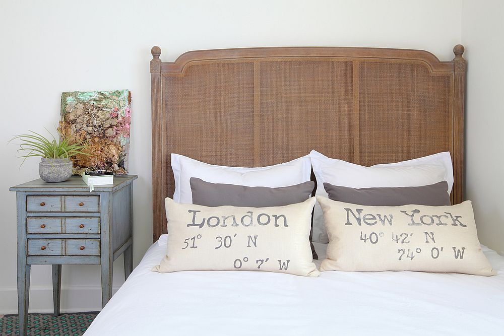 Bedroom with natural tones in white and distressed finishes for the bedside table