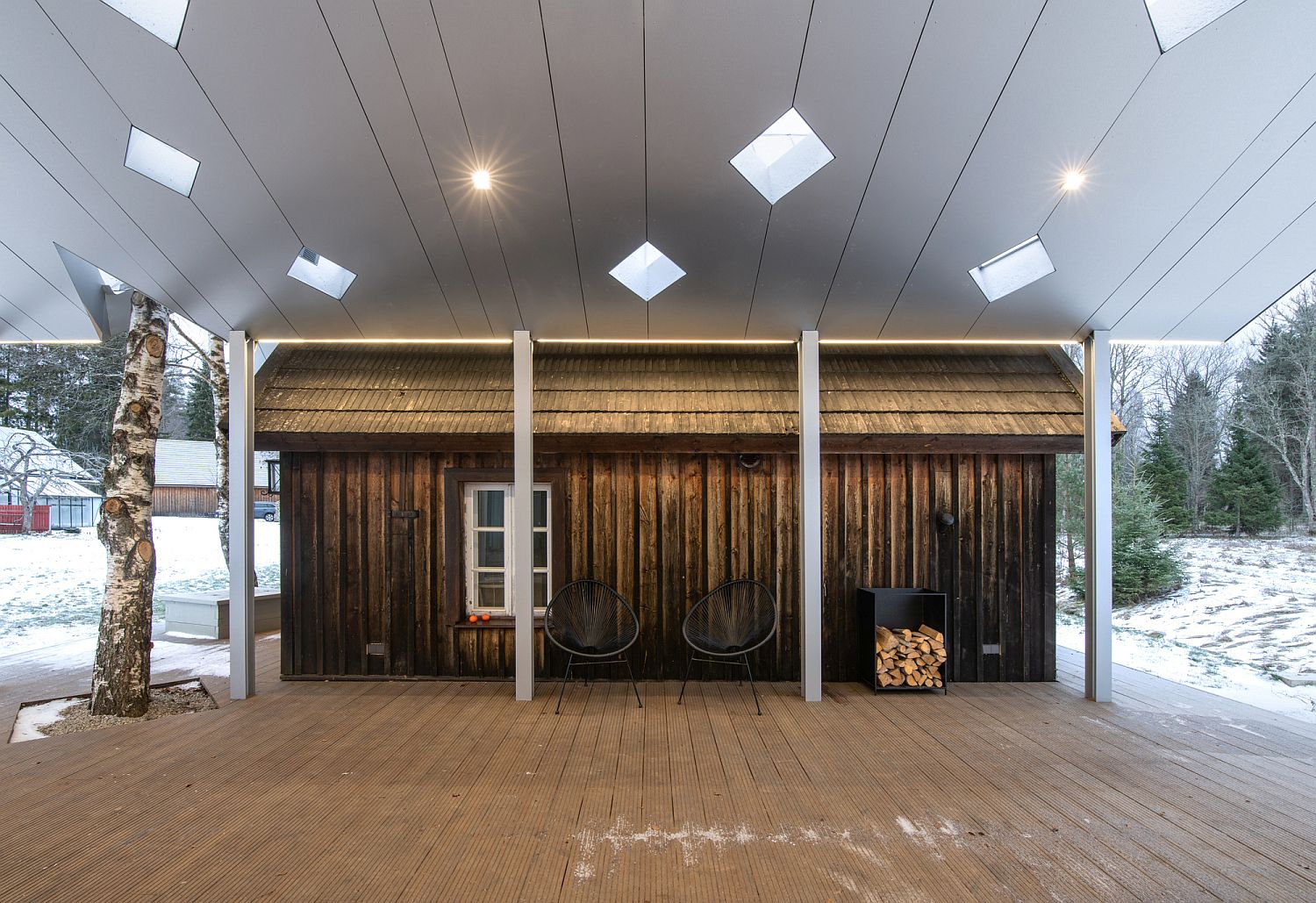 Central atrium offers a spacious sitting zone between the two saunas