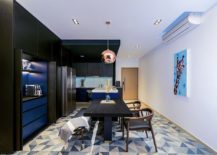 Contemporary-kitchen-and-dining-room-in-blue-and-black-with-a-white-backdrop-217x155