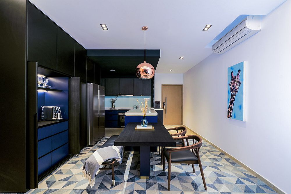 Contemporary kitchen and dining room in blue and black with a white backdrop